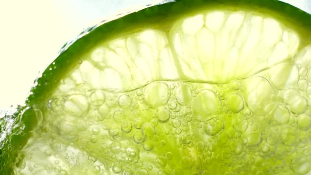lime in water, closeup, 4K