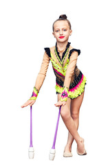 Little girl is engaged in rhythmic gymnastics with juggling clubs isolated on white.