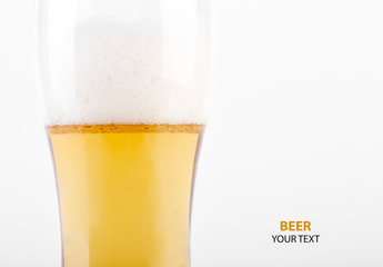 A glass of light beer on a white background. Alcoholic beverages