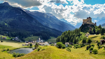 Mountains surrounding Tarasp, a village in the canton of Graubunden, Switzerland. It is dominated...