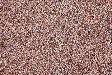 Dark Buckwheat texture. Buckwheat groats in skin (in shell).