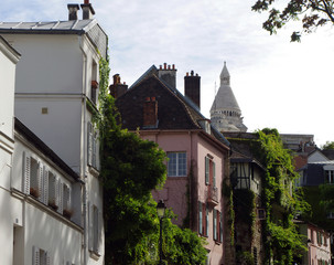 Houses and architecture of Montmartre in Paris with the basilica in the background