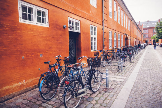cityscape, bicycle parking on a street in the historic center of Copenhagen, Denmark, a trip to Scandinavian countries
