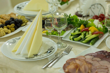 banquet hall of the restaurant, beautifully decorated tables with food	