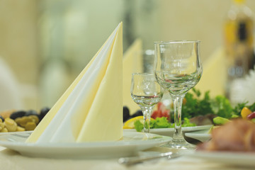 banquet hall of the restaurant, beautifully decorated tables with food	