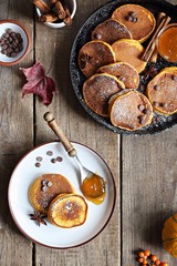 Pumpkin pancakes with chocolate chips fresh blueberry.  Overhead view