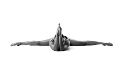 Young blonde woman in maillot practicing yoga lesson