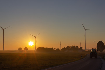 telegraph pole on road before horizon