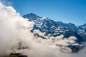 View from Mannlichen at the Bernese Alps (Berner Oberland, Switzerland). It is a mountain (2,343 metre) reachable from Wengen with a aerial cableway or from Grindelwald using a gondola cableway.
