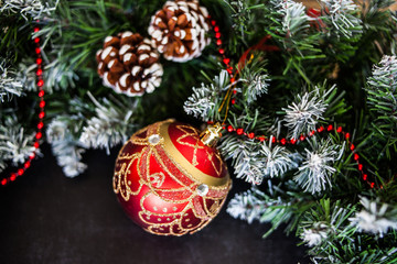 Red Christmas decoration bauble with ribbon bow isolated on white background