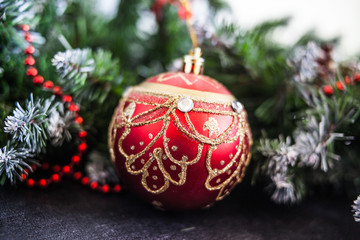 Red Christmas decoration bauble with ribbon bow isolated on white background