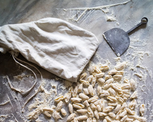 Cavatielli. Italian traditional fresh homemade pasta on a marble table