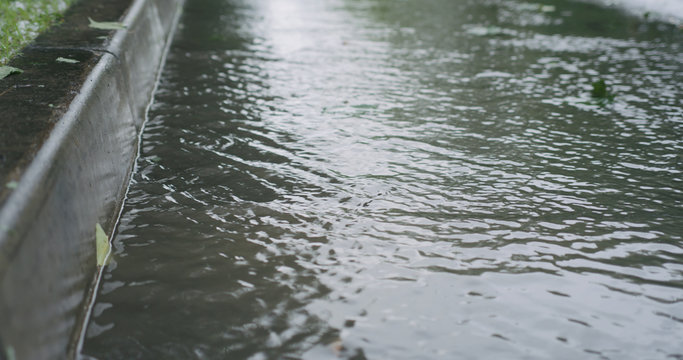 Water Streams On The Street After Rain