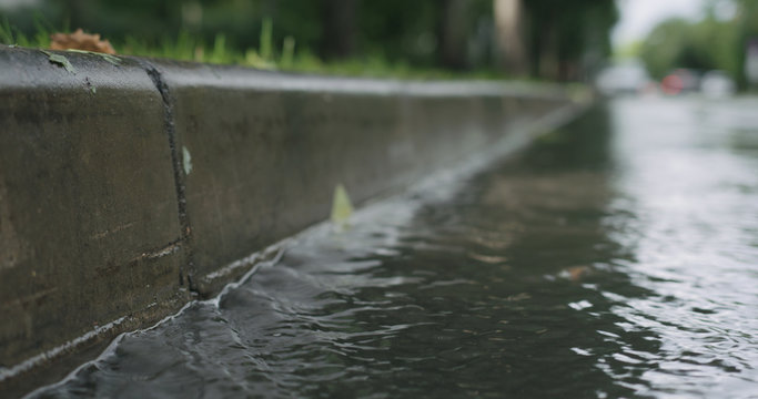 Water Streams On The Street After Rain