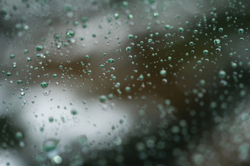 Closeup rain drops on glass with hydrophobic coating