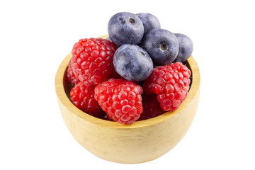 blueberry and raspberry in bowl isolated on white background - clipping paths