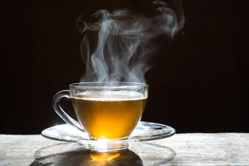 Hot tea cup on wood background