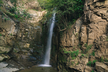 Fototapeta na wymiar Legvtakhevi waterfall in the gorge in Tbilisi