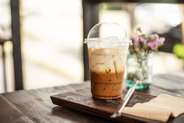 ice coffee and straw on wood table