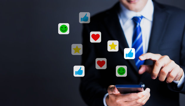 Businessman use smartphones to rate their satisfaction. Customer service experience and satisfaction survey concept