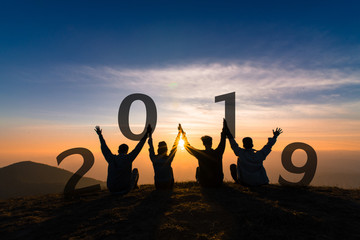 Newyear 2019 concept Silhouette of young friend jumping and hand shake for celebrate new year party