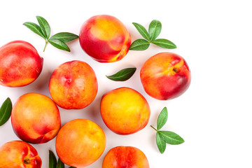 ripe nectarine with leaves isolated on white background with copy space for your text. Top view. Flat lay pattern