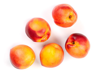 ripe nectarine with leaves isolated on white background. Top view. Flat lay pattern