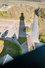 View from the lighthouse with a long shadow. Hirtshals Fyr in Hirtshals, North Jutland in Denmark, Europe