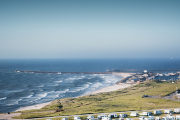 Camping with north sea ocean view with harbour overview on a bright summer day. Danish coastline,...