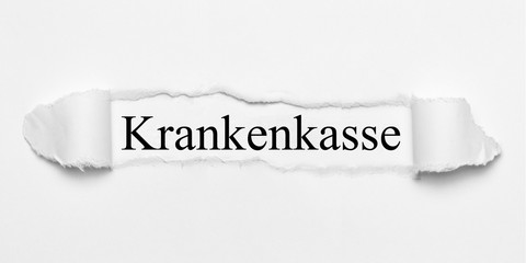 Krankenkasse auf weißen gerissenen Papier