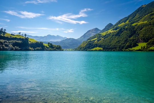 View over the Lake Lungern (Switzerland) on a September day. Lake Lungern (Lungerersee, Lungernsee or Lungerensee) is a natural lake in Obwalden which is named after the town Lungern on its shore.