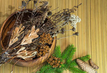 Christmas and New Year decorations. Dry branches, cones, fir branch. Warm tones.