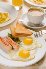 Traditional fried eggs and toasts