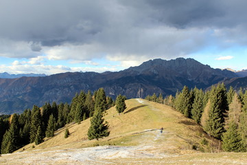 Fototapeta premium Presolana, monte Pora, Orobie alps. View of Presolana mountains from monte Pora with the first artificial snow of the winter season.