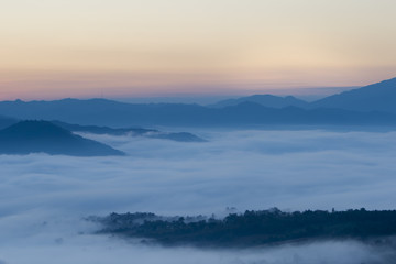Fototapeta na wymiar Sunrise in Northern Thailand with a misty landscape and hills