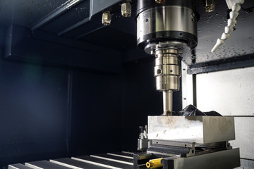 The  CNC milling machine cutting the mold part with the index-able ball end mill .The hi-Technology manufacturing process.