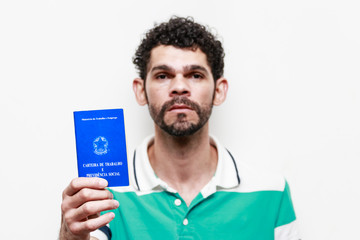 Brazilian man with document work and social security, (Carteira de Trabalho e Previdencia Social)...