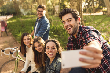 Friends in the park making a selfie