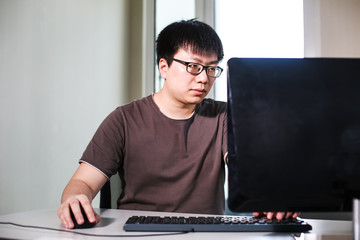 young man working with computer