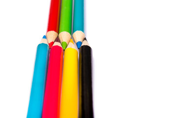 Seven colored pencils. The colors red, green, blue, cyan, magenta, yellow and black. Concept of...