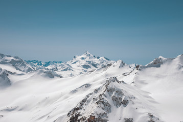 Fototapeta na wymiar Winter snow covered mountain peaks in Caucasus. Great place for winter sports. Mount Shtavler