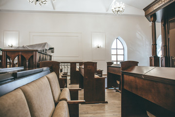 Synagogue inside interior with rows of benches for prayers