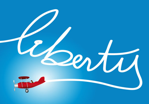 un avion inscrit dans le ciel le mot liberty