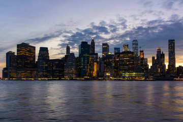 Manhattan skyline from Brooklyn illuminated at twilight (New York, USA)