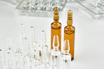 White and brown ampoules with medicine