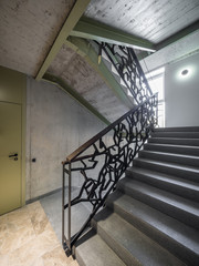Staircase, staircase in a modern house. Iron decorative railings.