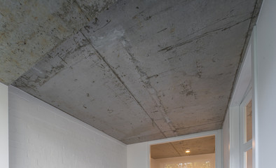 Concrete ceiling and lighting in a modern apartment. Concrete style in the apartment. © Aleks Kend