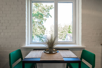 The kitchen and dining room in a modern apartment. Kitchen area in studio apartments. © Aleks Kend