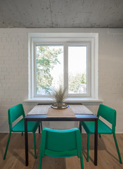 The kitchen and dining room in a modern apartment. Kitchen area in studio apartments. © Aleks Kend