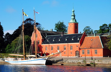 Halmstad Castle (Halmstads slott), a 17th-century castle on the Nissan river in Halmstad, in the province of Halland, Sweden with a two-master moored in front